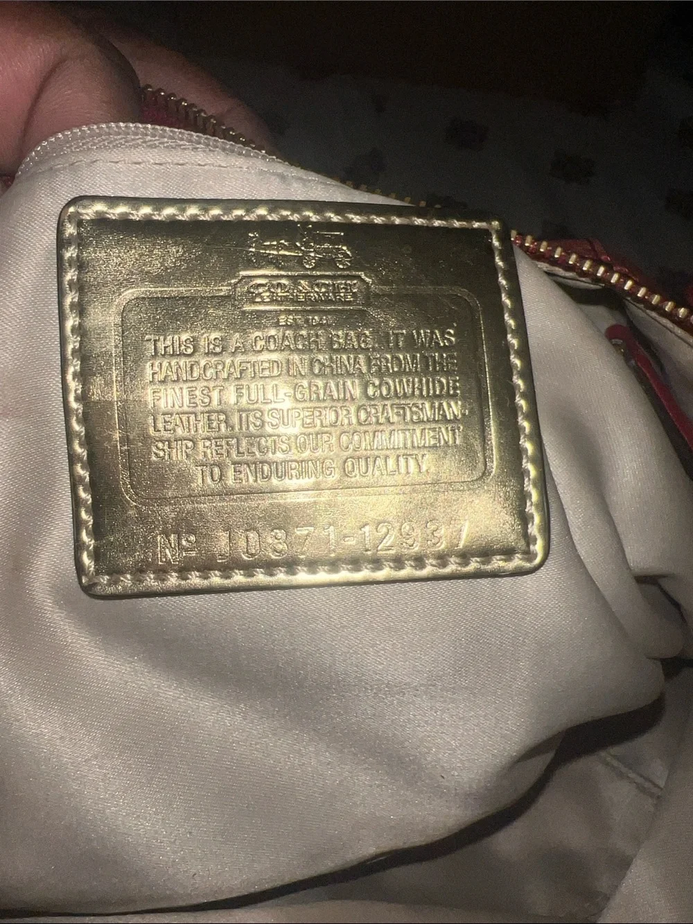 Coach Coral-Red Leather Satchel with Gold Accents